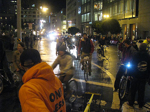 Tail end turns on Powell from Geary as the traditional loop around Union Square commences. San Francisco, Critical Mass, January 29, 2010.